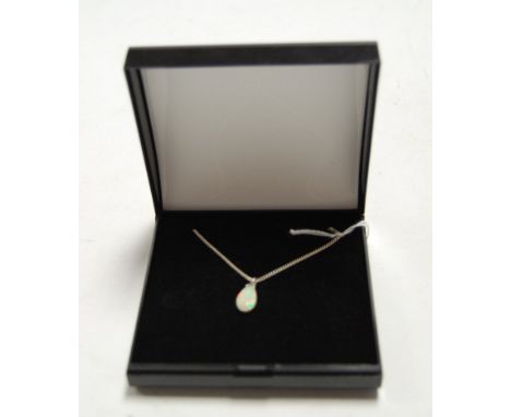 A teardrop shaped opal pendant, approx 3.5ct, on finelink chain, boxed