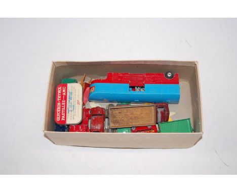 A box of mixed playworn diecast vehicles to include Corgi Chipperfields horse transporter, Dinky Aston Martin, Lion Car Renau