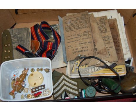 A box of miscellaneous militaria, to include; boxed anti-gas eye MkII eye shields, sergeants stripes, badges, hip flask etc 