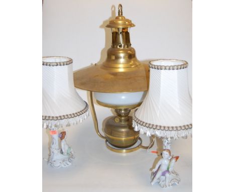 An early 20th century brass hanging oil lantern, having opalescent glass shade; together with a pair of Continental porcelain