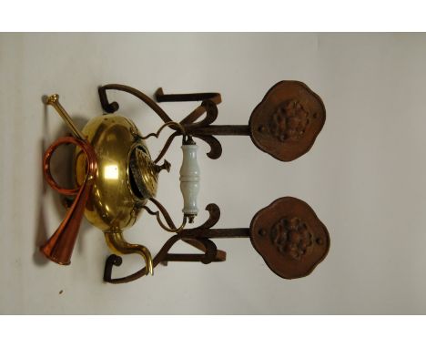 A box of miscellaneous metalware to include; pierced brass trivet, turned brass fire tools, brass doorstops, range kettle etc
