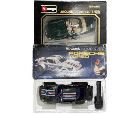 A pair of boxed car models, to include: - An electronic sonic controlled Porsche Turbo by Rojo Toys - A Jaguar E Cabriolet 19