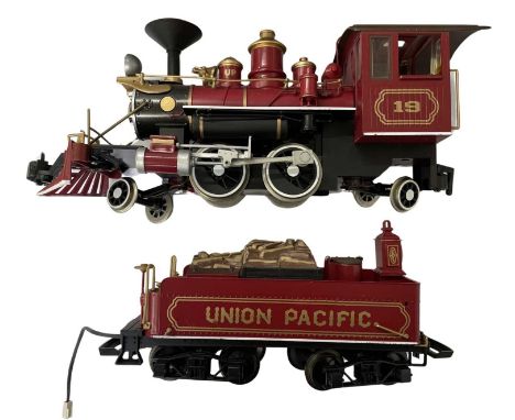 A Bachmann G gauge Union Pacific steam locomotive and wood-loaded tender