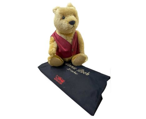 A large Steiff Winnie the Pooh bear in red waistcoat with internal growler. Limited number 02249/3500, with original black co