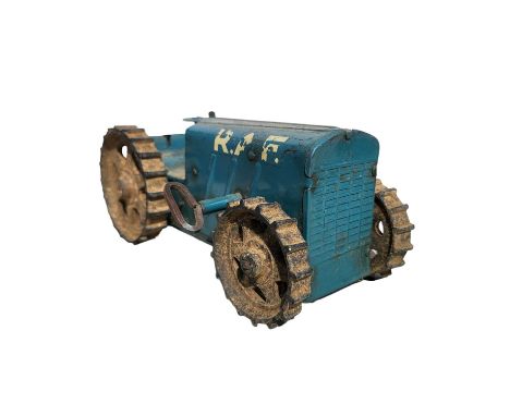 A Triang pressed steel clockwork tractor with key