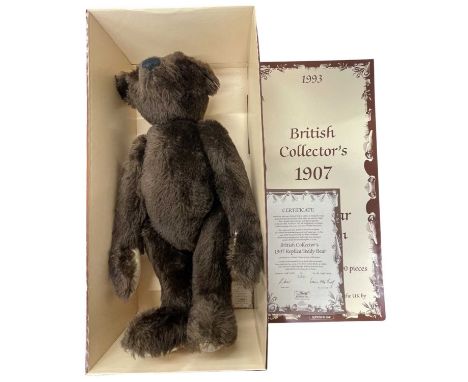 A boxed limited edition Steiff British Collector's 1907 Replica Teddy Bear in dark brown with certificate. Number 01911 / 300
