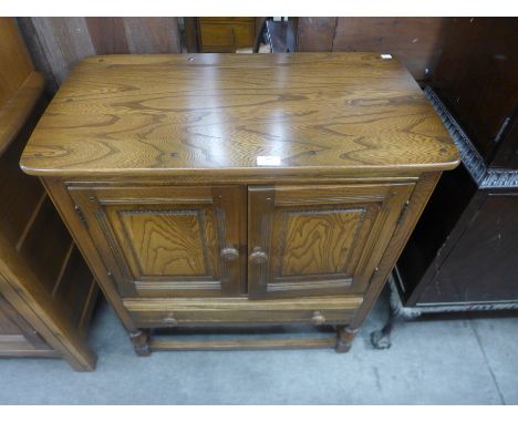 An Ercol Golden Dawn credence cupboard 