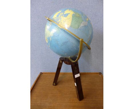 A terrestrial globe on tripod stand 