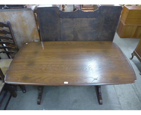 An Ercol elm refectory table 