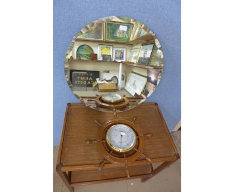 A mirror and a small ship wheel barometer 