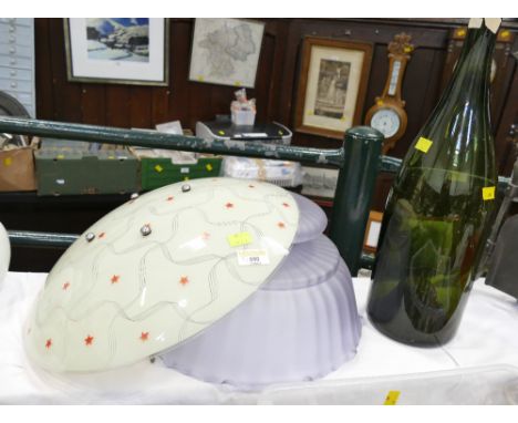 Two vintage ceiling hanging light shades, one with swirls and star decoration, and large vintage bottle, possibly a Magnum, h