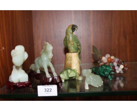 THREE MODERN CARVED JADE STYLE ANIMAL FIGURES, TOGETHER WITH A MALACHITE FIGURE OF A LION, POLISHED STONE GRAPES ETC. (7)  