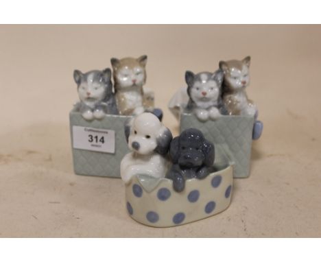 THREE NAO FIGURES OF CATS AND DOGS IN BASKETS 