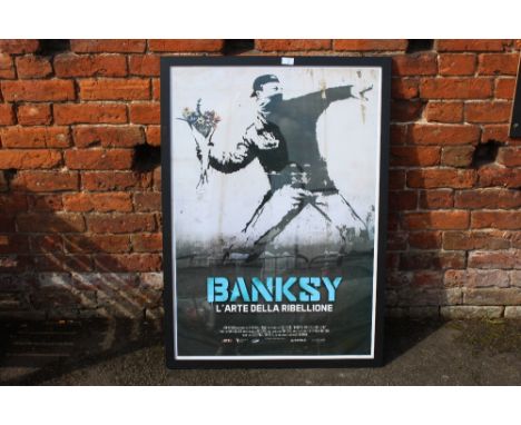 A LARGE FRAMED AND GLAZED BANKSY L'ARTE DELLA RIBELLIONE PRINT OVERALL SIZE INCLUDING FRAME - 105CM X 75CM 