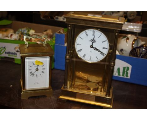 A BROOKS AND BOSTOCK QUARTZ CARRIAGE CLOCK WITH A EIGHT DAY BRASS AND GLASS CHIMING MANTEL CLOCK