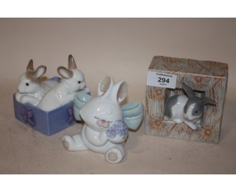 A NAO FIGURE OF RABBITS IN A BASKET, TOGETHER WITH A NAO SEATED RABBIT FIGURE AND A LLADRO OF A RABBIT IN A FRAME (3) 