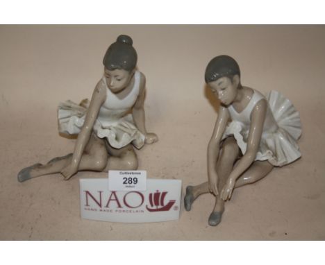 TWO NAO SEATED BALLERINA FIGURES, TOGETHER WITH A NAO CERAMIC ADVERTISING SIGN (3) 