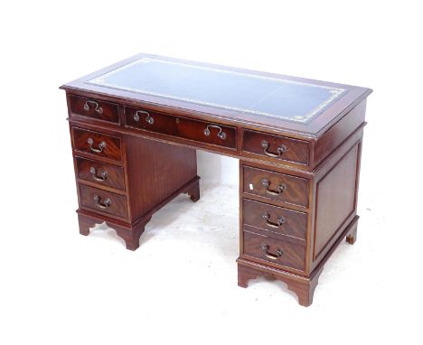 A reproduction mahogany twin-pedestal writing desk, with blue embossed leather skiver, W122cm, H76cm, D60cm 