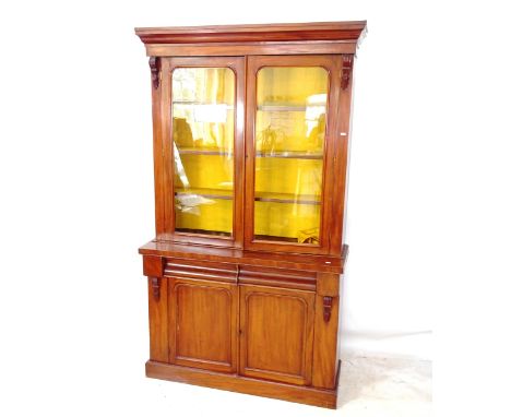 A Victorian mahogany library bookcase, the top section having 2 glazed doors and 3 adjustable shelves, the bottom section hav