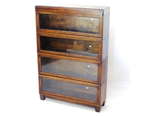 An Antique oak 4-shelf Globe-Wernicke bookcase, W85cm, H127cm, D25cm (with labels) 