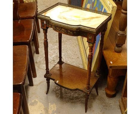 An Antique walnut side table, with shaped marble top and pierced brass gallery, with a shelf below, on fluted legs and ormolu