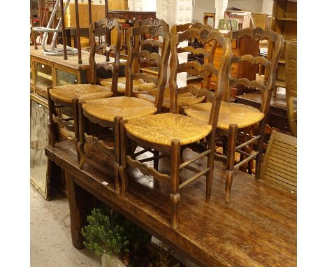A set of 6 oak ladder-back and rush-seated dining chairs 