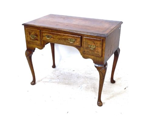 A 1930s crossbanded walnut kneehole writing desk, with 3 short drawers, and shell carved cabriole legs, W92cm, H75cm, D53cm 