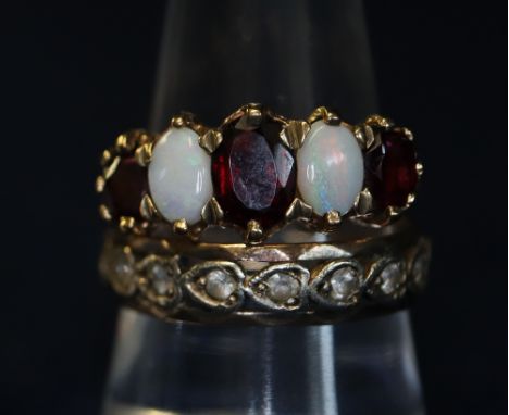 9ct gold opal and garnet ring and an eternity style ring.(B.P. 24% incl. VAT)