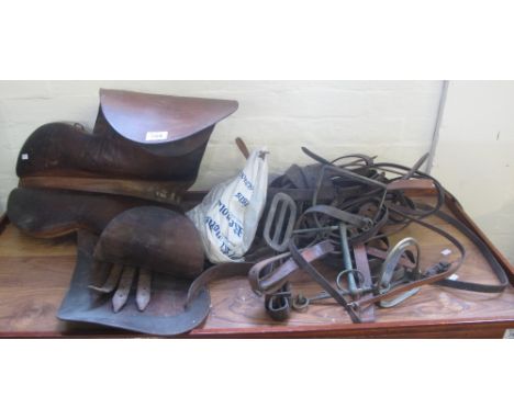 Vintage leather saddle with reins and stirrups. (B.P. 24% incl. VAT)