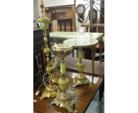 A collection of gilt and onyx furnishing items to include: coffee table, tripod occasional table, standard and table lamp, an