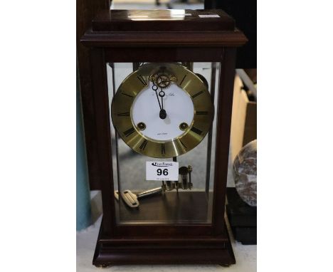 Modern two train four glass mahogany cased mantel clock with brass Roman chapter ring, exposed escapement and mercury compens