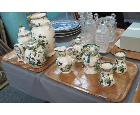 Two trays of Masons Ironstone Chartreuse to include; pouch shaped dresser jugs, ginger jar and cover, mantel clock, two handl