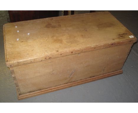 19th century pine trunk of rectangular form with metal loop carrying handles.(B.P. 24% incl. VAT)