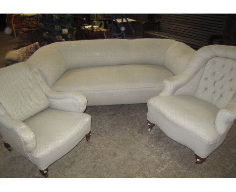 Late 19th/early 20th century three-piece suite to include a three seater sofa and a pair of 'ladies and gents' chairs. (3)(B.