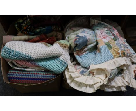 Two boxes of assorted vintage textiles to include; check woollen blankets, crochet woollen blankets, a peacock design throw, 