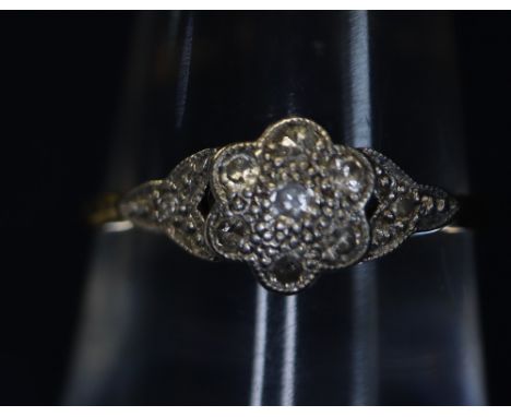 Diamond cluster ring.(B.P. 24% incl. VAT) CONDITION REPORT: Tiny little diamonds, very dirty, one stone seems cracked. Shank 