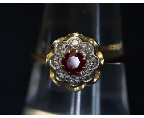 18ct gold ruby and diamond cluster ring. (B.P. 24% incl. VAT)