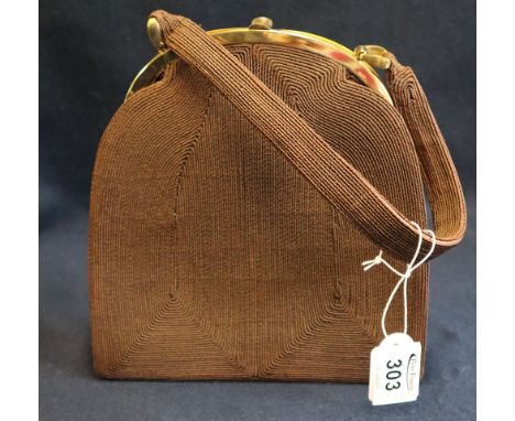 A brown vintage 1940's genuine cordé handbag with lucite detail around the clasp. (B.P. 24% incl. VAT)