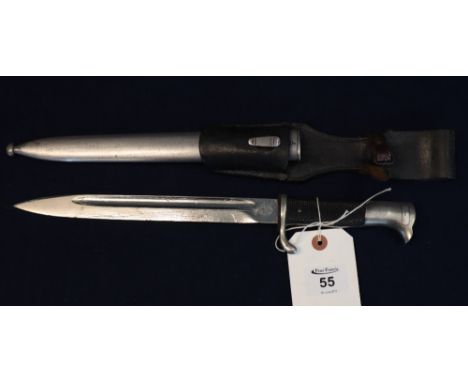 A German Second World War period Carl Eiskhorn of Solingen knife with checkered grip, single edged fullered blade, metal scab