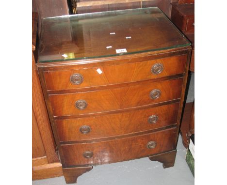 Reproduction mahogany bow front narrow chest of four drawers on bracket feet.(B.P. 24% incl. VAT)