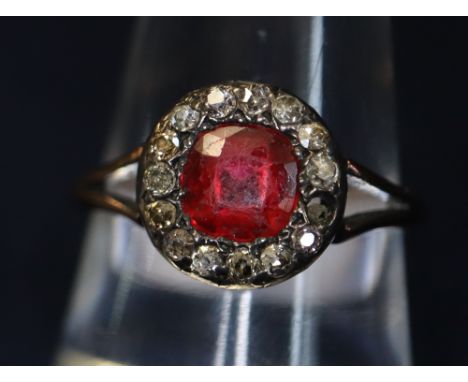 18ct gold red stone and diamond cluster ring.(B.P. 24% incl. VAT)