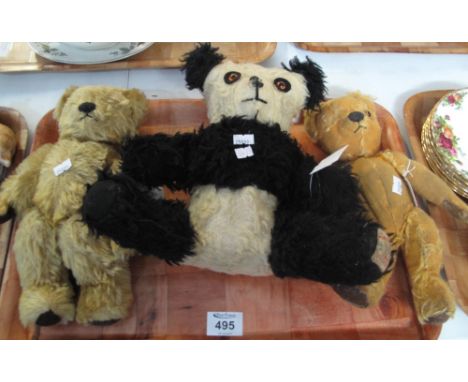 Two vintage teddy bears with moveable limbs, together with a vintage panda bear. (B.P. 24% incl. VAT)