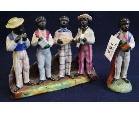 Pottery figural group of four black musicians on naturalistic base, together with another single black musician playing the a