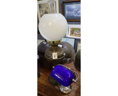 Brass double burner oil lamp with brass reservoir and pedestal base, white glass shade and clear chimney, together with a sma