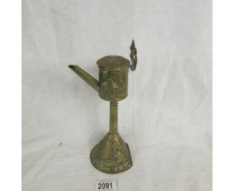 A 19th century brass whale oil lamp.