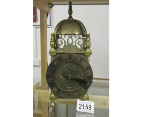 A brass lantern clock.