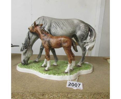 A Goebel group figure of a Horse and Foal, stamped to underside 3231318, 1974.