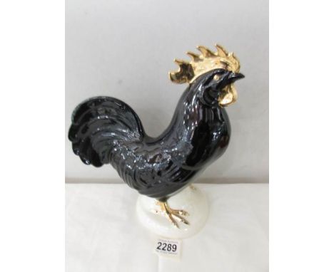 A Goebel cockerel figure.
