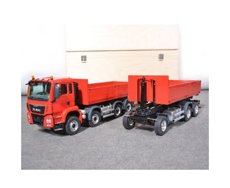 ScaleArt Germany 1:14 scale RC model truck and trailer; MAN TGS heavy duty truck with eight wheels, red bad and back; with at