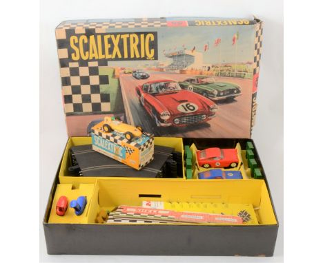 Scalextric slot car set 55, with C68 Aston Martin DB4 GT; C69 Ferrari GT 250 Berlinetta; controllers; track and parts; looks 